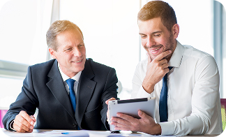 Two businessmen, smiling looking at notes