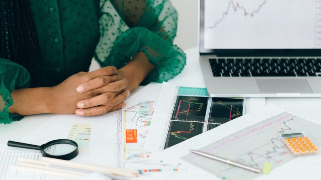 analyzing financial charts and graphs at a desk